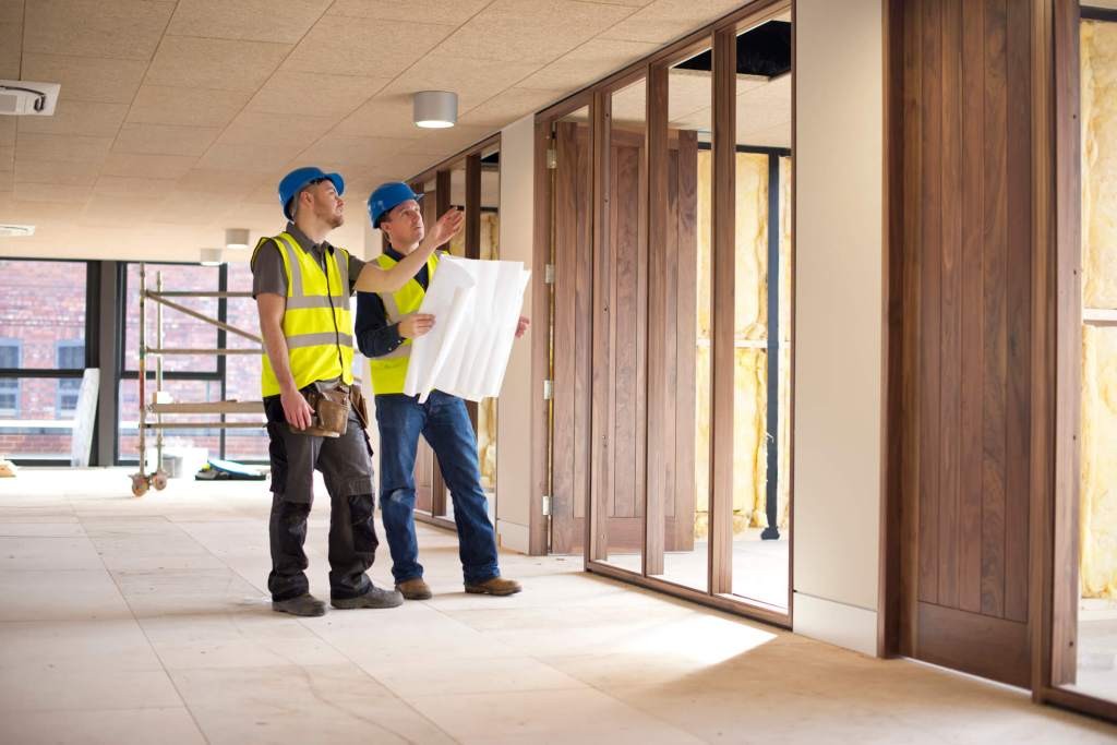 Professional inspector checking hurricane door certification labels